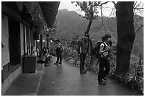 Hikers at Sangseonam hermitage, Samneung Valley, Mt Namsan. Gyeongju, South Korea (black and white)