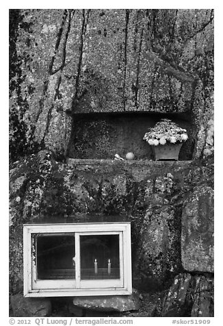 Shrine with candles and flowers, Mt Namsan. Gyeongju, South Korea (black and white)