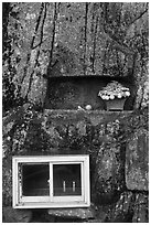 Shrine with candles and flowers, Mt Namsan. Gyeongju, South Korea (black and white)