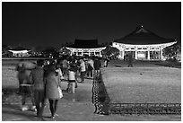 Crowd visiting Anapji Pond at night. Gyeongju, South Korea (black and white)