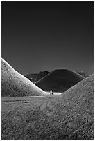 Grassy burial tumulus at night. Gyeongju, South Korea ( black and white)