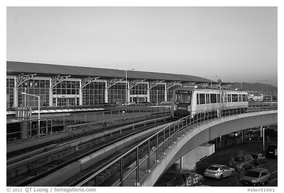 Subway on elevated bridge near airport, Busan. South Korea (black and white)