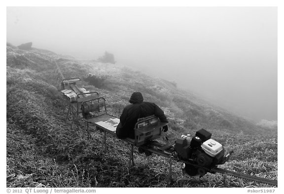 Man riding monorail on mountain, Mount Halla. Jeju Island, South Korea