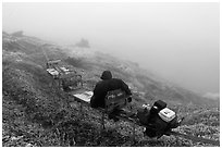 Man riding monorail on mountain, Mount Halla. Jeju Island, South Korea (black and white)