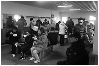 Hikers eating noodles inside Witseoreum shelter, Hallasan. Jeju Island, South Korea ( black and white)