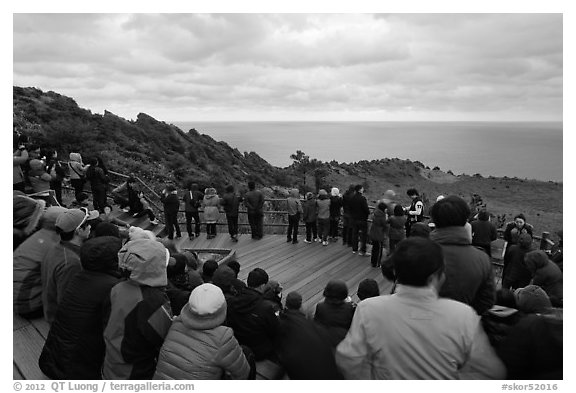 Viewers waiting for sunrise on Ilchulbong. Jeju Island, South Korea (black and white)