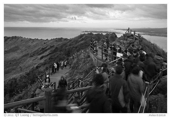 Tourists on top of Seongsang Ilchulbong. Jeju Island, South Korea