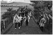 Tourists walking up path, Ilchulbong. Jeju Island, South Korea ( black and white)