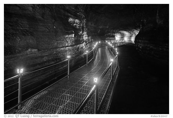 Walkway in Geomunoreum cave with world heritage logos. Jeju Island, South Korea