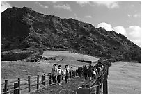 Seongsang Ilchulbong and tourists on path. Jeju Island, South Korea (black and white)