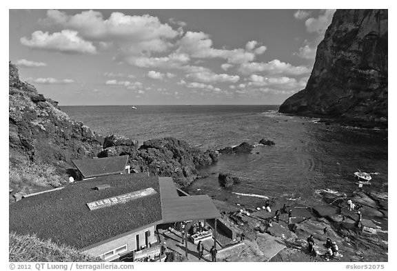 Cove and Haeneyo house, Seongsang Ilchulbong. Jeju Island, South Korea (black and white)