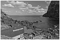 Cove and Haeneyo house, Seongsang Ilchulbong. Jeju Island, South Korea (black and white)