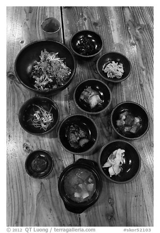 Meal with assorted kim-chi. Jeju Island, South Korea (black and white)