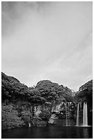 Cheongjiyeon Pokpo falls and clouds, sunrise, Seogwipo. Jeju Island, South Korea ( black and white)