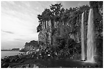 Jeongbang Pokpo, only waterfall in Asia dropping into sea, Seogwipo. Jeju Island, South Korea (black and white)