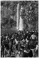 Crowd at the base of waterfall, Jeongbang Pokpo, Seogwipo. Jeju Island, South Korea (black and white)