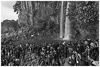 Tourists at the base of Jeongbang Pokpo falls, Seogwipo. Jeju Island, South Korea ( black and white)