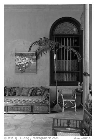 Chairs and blue wall, Cheong Fatt Tze Mansion. George Town, Penang, Malaysia