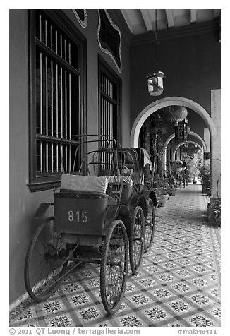 Rickshaws in front gallery, Cheong Fatt Tze Mansion. George Town, Penang, Malaysia (black and white)