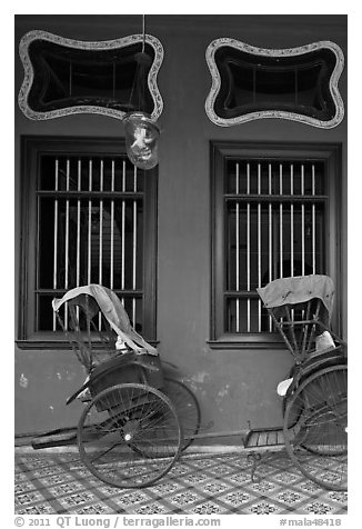 Rickshaws and windows, Cheong Fatt Tze Mansion. George Town, Penang, Malaysia (black and white)