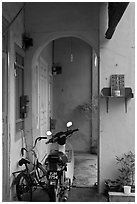 Motorcycle and altar outside townhouse. George Town, Penang, Malaysia ( black and white)