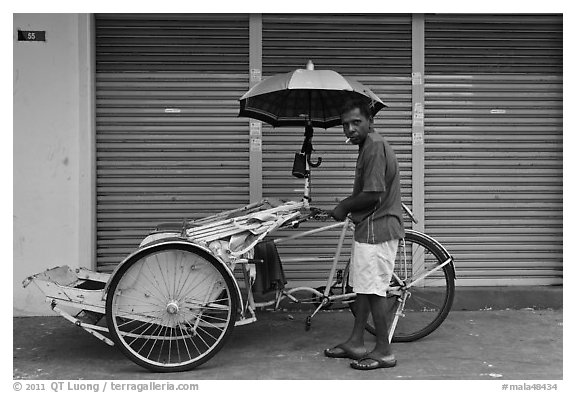 Driver and trishaw. George Town, Penang, Malaysia (black and white)