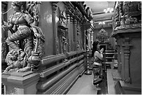 Woman worshipping at Sri Mariamman Temple. George Town, Penang, Malaysia (black and white)