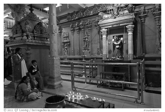 Family in prayer, Sri Mariamman Temple. George Town, Penang, Malaysia