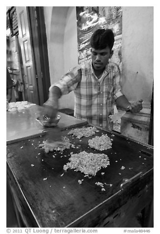 Man preparing indian food. George Town, Penang, Malaysia (black and white)