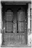 Old green door locked with chain. George Town, Penang, Malaysia ( black and white)