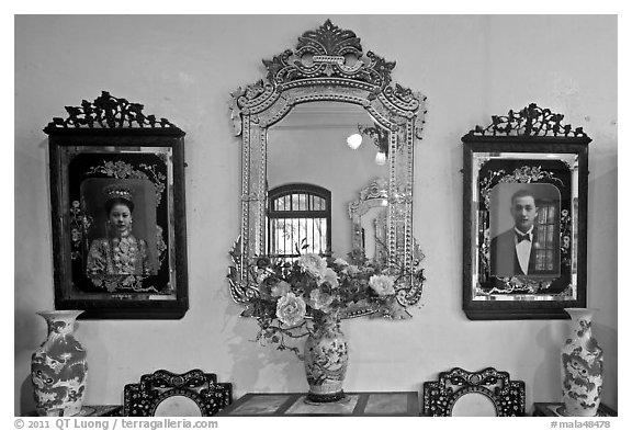 Portraits and mirors, Pinang Peranakan Mansion. George Town, Penang, Malaysia (black and white)