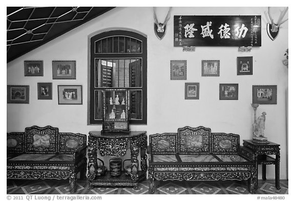 Antique furniture and images, Pinang Peranakan Mansion. George Town, Penang, Malaysia (black and white)