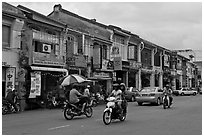 Chinatown street with traffic and storehouses. George Town, Penang, Malaysia ( black and white)