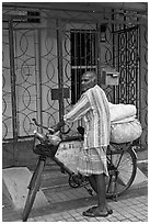 Malay with loaded bicycle. George Town, Penang, Malaysia (black and white)