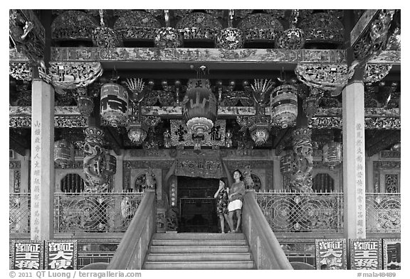 Women standing at Khoo Kongsi entrance. George Town, Penang, Malaysia (black and white)