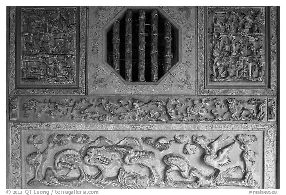 Octogonal window and stone carvings, Khoo Kongsi. George Town, Penang, Malaysia