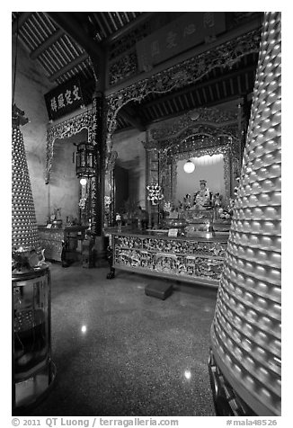Altar and wheels in motion, Hainan Temple. George Town, Penang, Malaysia (black and white)