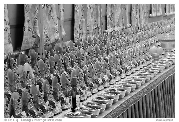 Rows of Jambhala figures, Gelugpa Buddhist Association temple. George Town, Penang, Malaysia