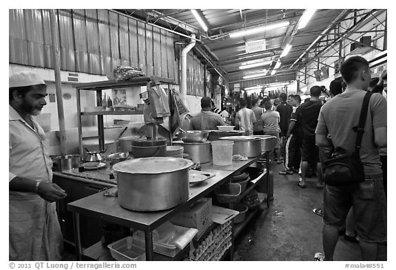 People waiting in line at popular eatery. George Town, Penang, Malaysia