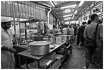 People waiting in line at popular eatery. George Town, Penang, Malaysia (black and white)