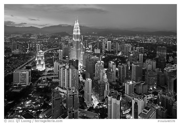 KL skyline with Petronas Towers from above, dusk. Kuala Lumpur, Malaysia (black and white)