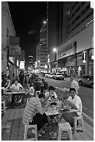 Street restaurant at night, Chinatown. Kuala Lumpur, Malaysia (black and white)