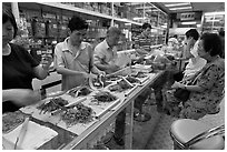 Store selling traditional Chinese medicine herbs. Kuala Lumpur, Malaysia (black and white)