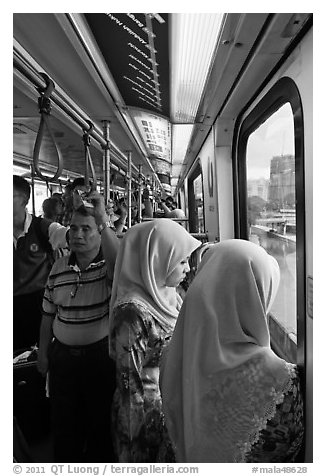 Inside Light Rail Transit (LRT) car. Kuala Lumpur, Malaysia (black and white)