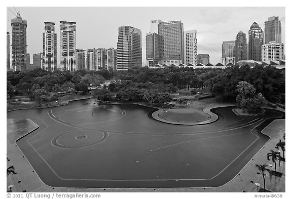 KLCC Park surrounded by high-rise towers. Kuala Lumpur, Malaysia (black and white)