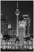 Sultan Abdul Samad Building, Petronas Towers, and Menara KL at night. Kuala Lumpur, Malaysia (black and white)