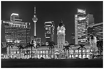KL night skyline with Sultan Abdul Samad Building and Menara KL. Kuala Lumpur, Malaysia (black and white)