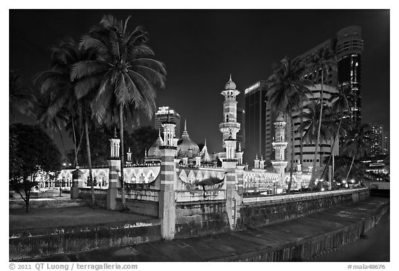 Masjid Jamek mosque and palm tree grove at night. Kuala Lumpur, Malaysia (black and white)