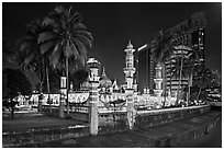 Masjid Jamek mosque and palm tree grove at night. Kuala Lumpur, Malaysia (black and white)