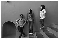 Young women with islamic headscarfs and modern fashions. Malacca City, Malaysia (black and white)